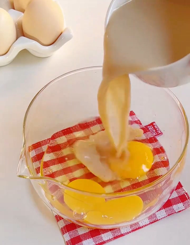 In a bowl, crack the eggs and add the milk tea