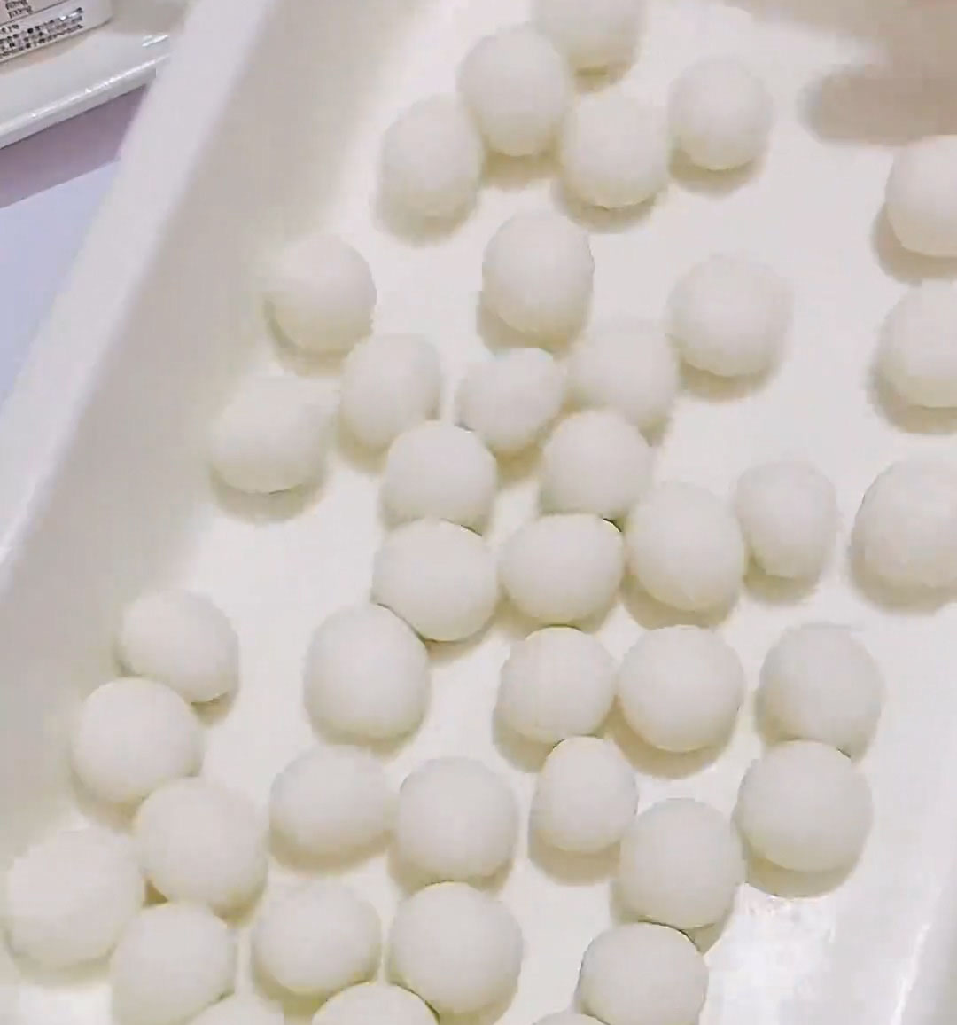Pinch off small pieces of dough and roll them between your palms to form tiny, bite sized balls