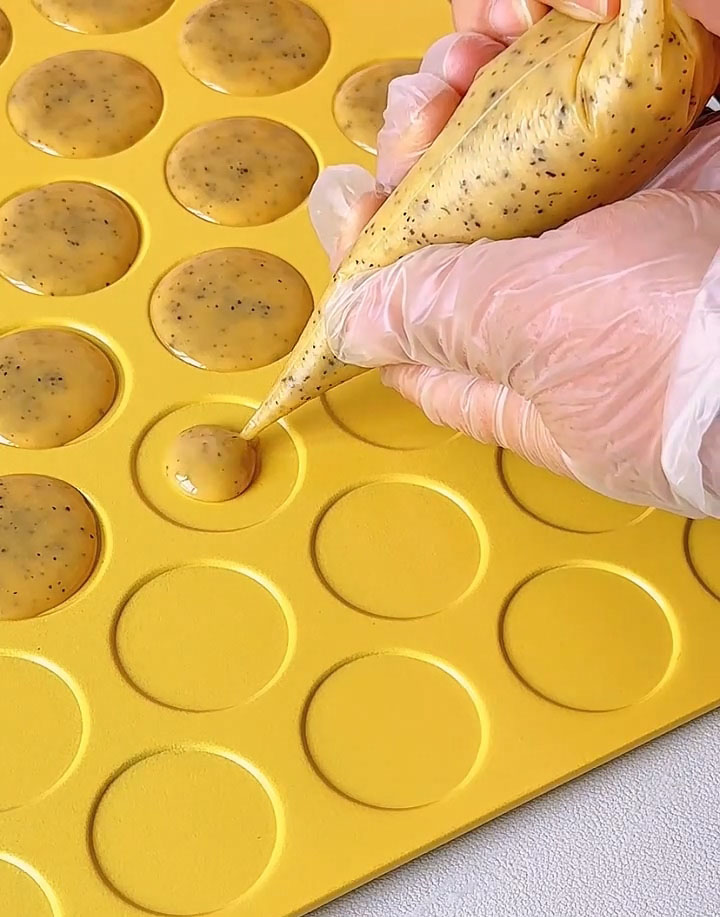 Pipe the batter onto the prepared baking sheet