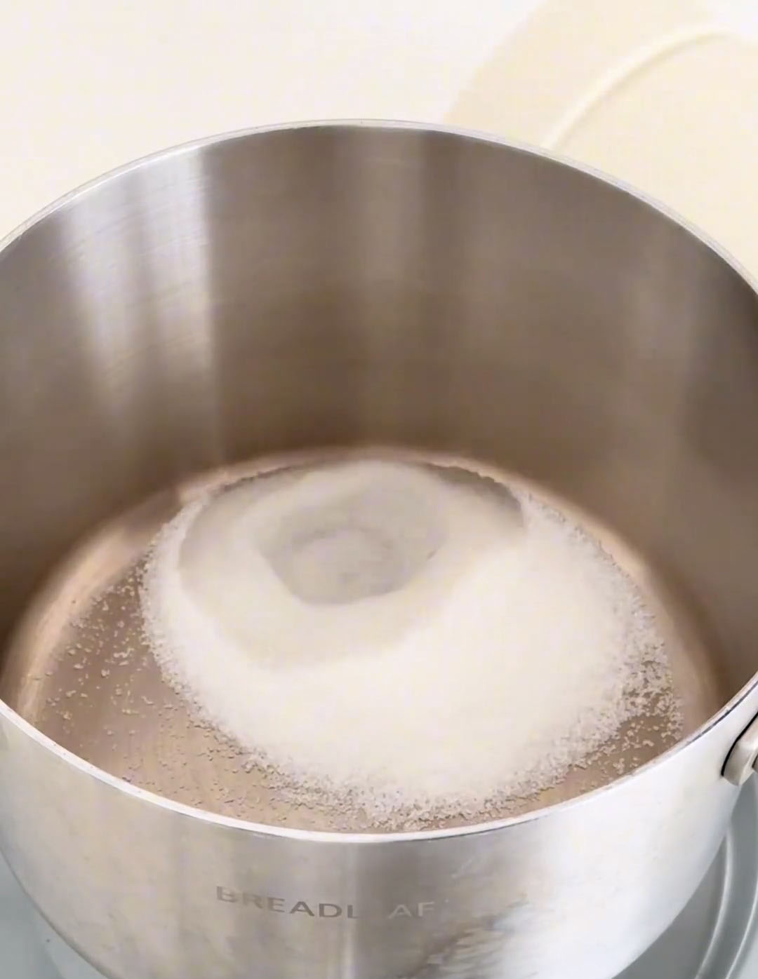 Place 40g white sugar and 15g water in a small saucepan