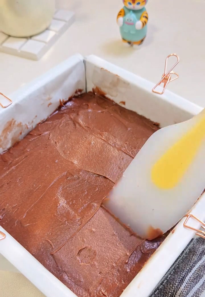 Pour the batter into the prepared pan and use a spatula to spread it evenly