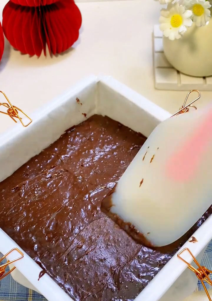 Pour the batter into the prepared pan and use a spatula to spread it evenly