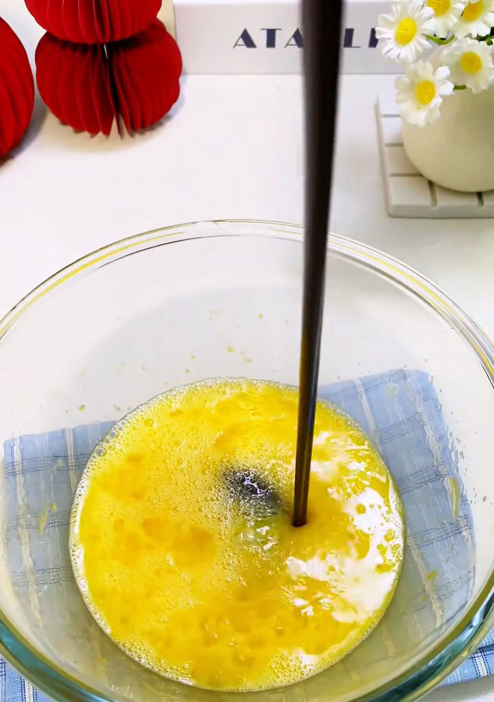 Pour the cooled chocolate butter mixture into the egg mixture