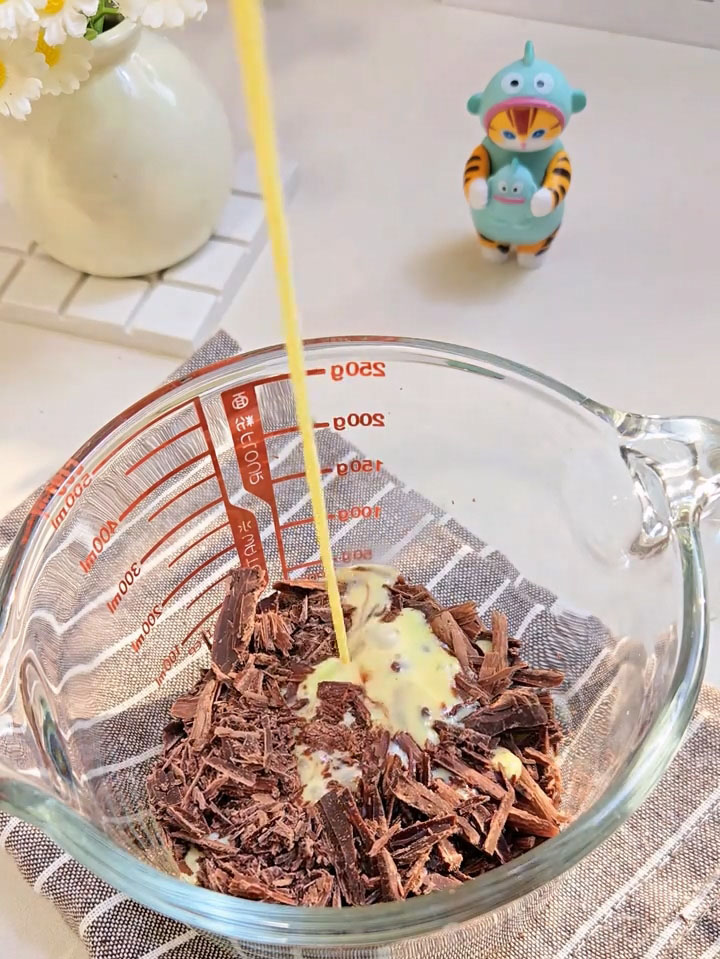 Pour the hot cream over the dark chocolate