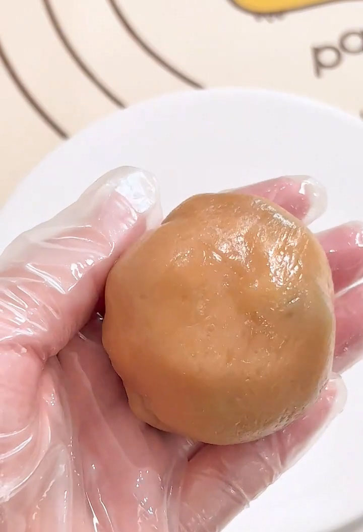 Roll the assembled ball gently between your palms to smooth the surface