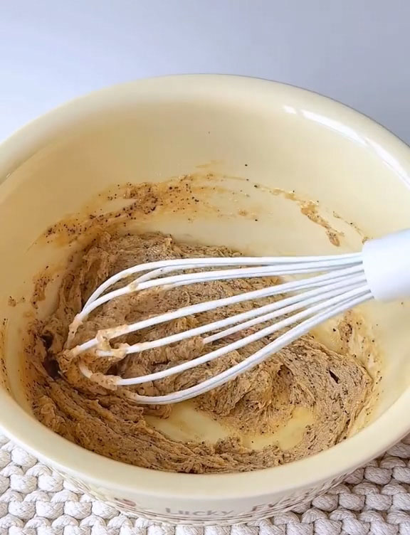 Sift in 50 g cake flour and fold gently with a spatula until no dry streaks remain