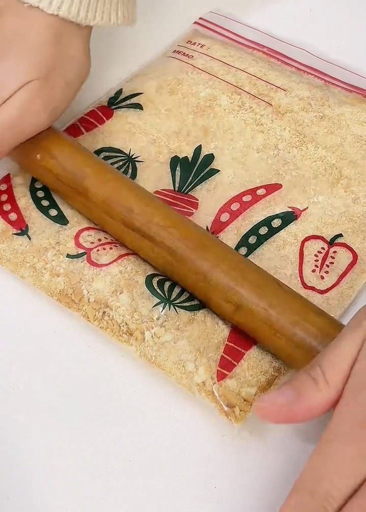 Use a rolling pin to crush them until they become fine crumbs with no large chunks