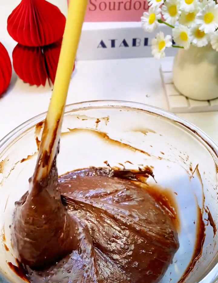 Use a silicone spatula to fold gently until no dry flour remains and the batter is smooth