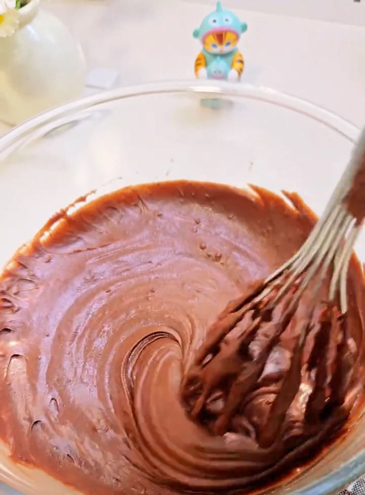 Use a spatula to fold gently until no dry flour remains and the batter is smooth