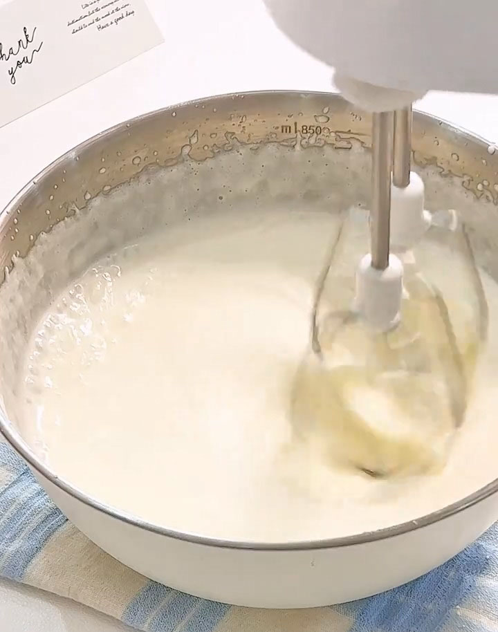Use an electric hand mixer to whip the cream until it reaches a yogurt like consistency