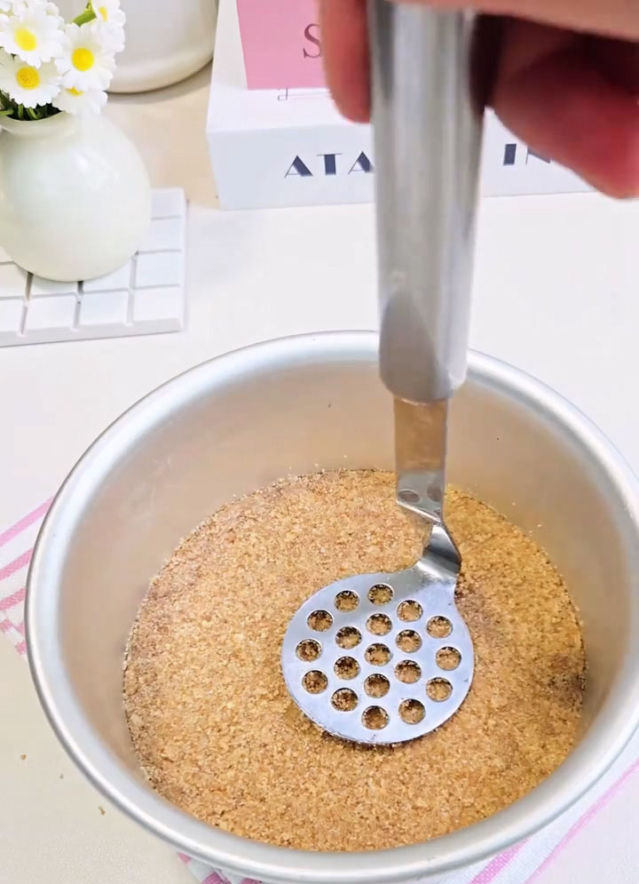 Use the bottom of a flat glass or a measuring cup to press the crumbs down firmly