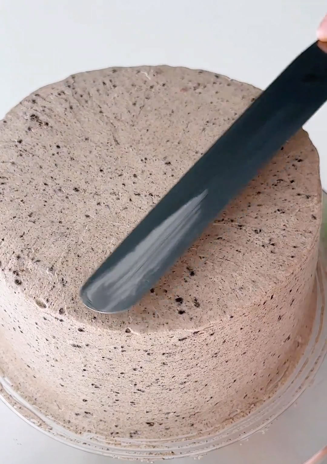 Use the remaining Oreo salted buttercream to frost the entire cake