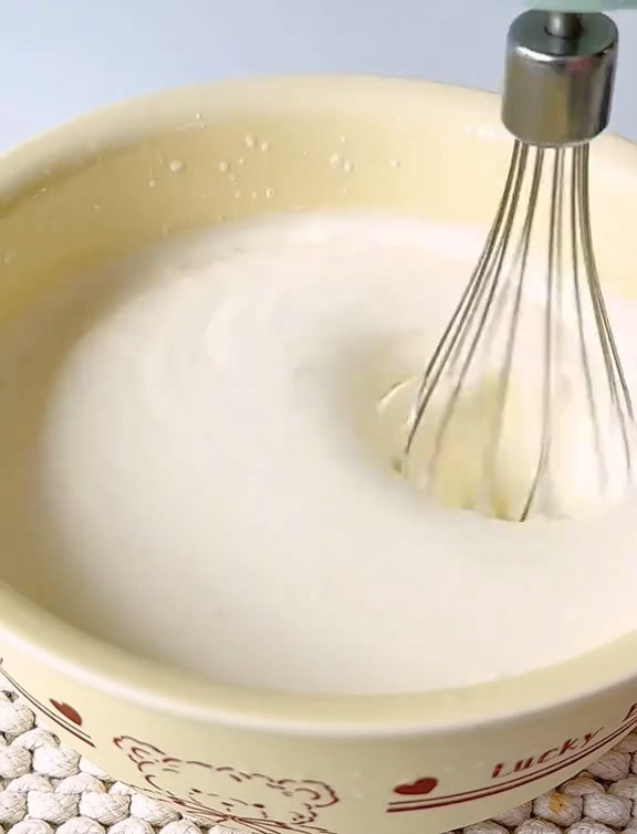 Whip with an electric mixer on medium speed until the cream reaches a yogurt like consistency