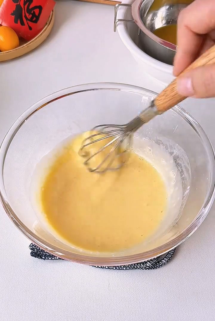 Whisk with a hand whisk until the mixture is fully blended and slightly frothy