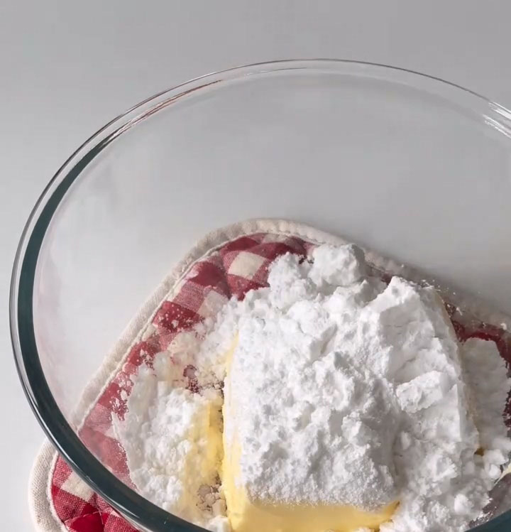 add the softened butter and powdered sugar