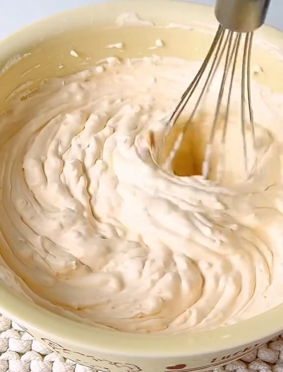 continue whipping until the cream holds stiff peaks