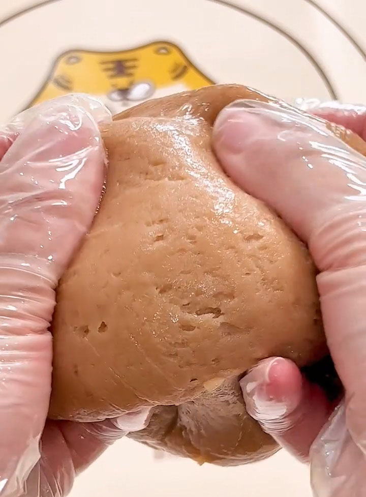 knead the skin by folding, pressing, and pulling it repeatedly until it becomes smooth, elastic, and no longer sticky to the touch