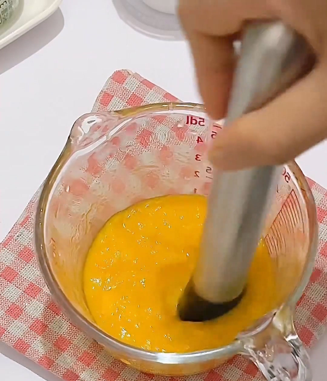mash or puree it thoroughly until it becomes a smooth, thick mango paste