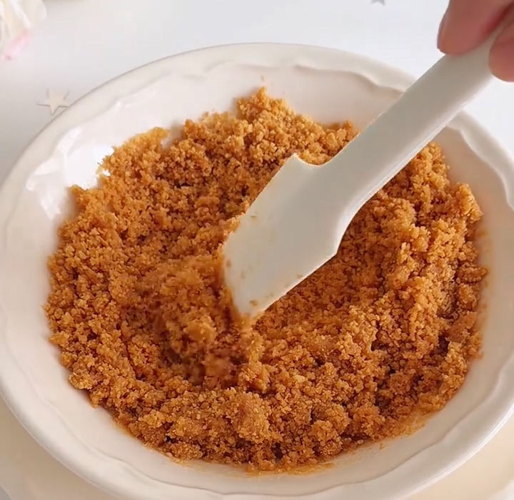 mix thoroughly until every crumb is coated and the mixture holds together when pressed