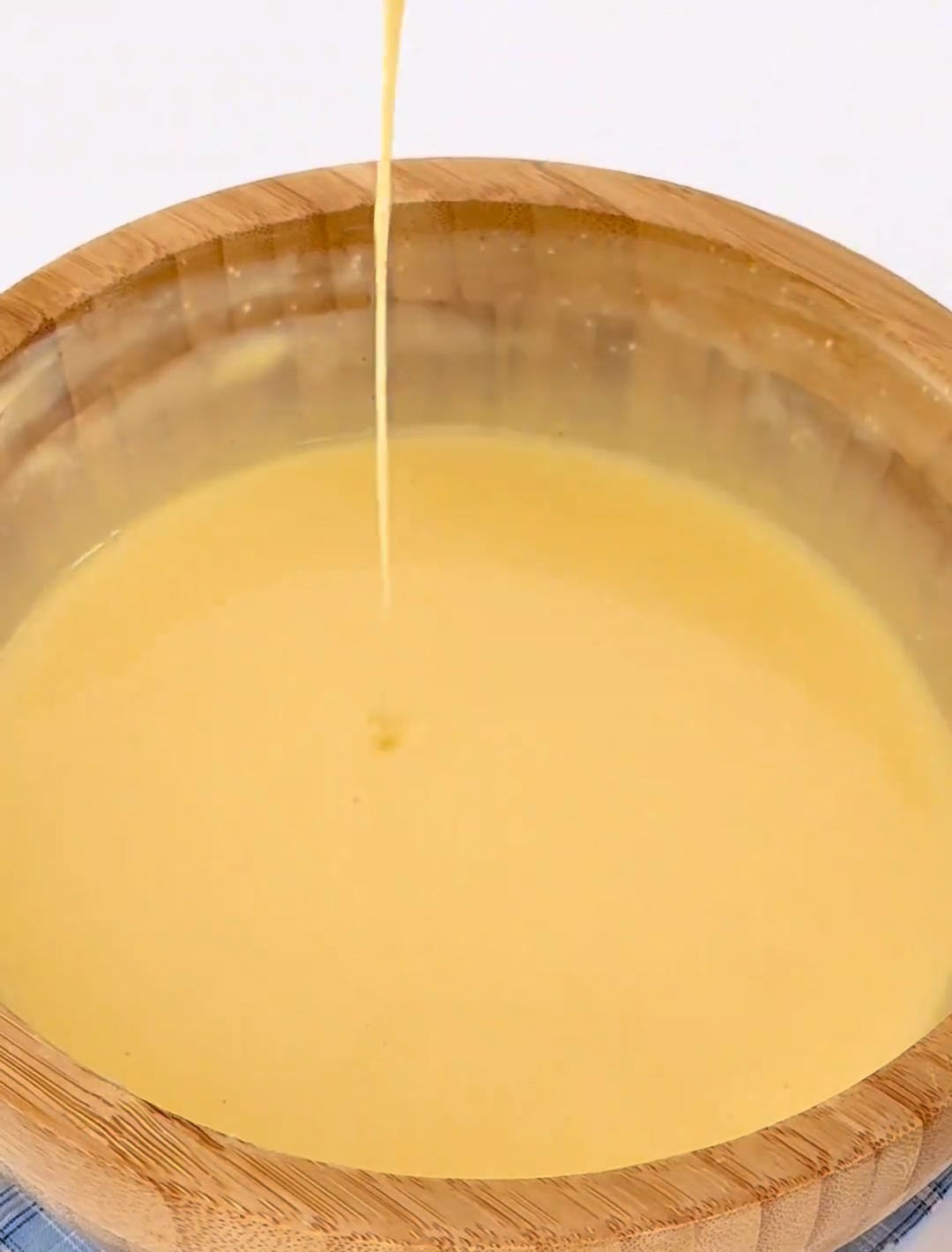 mixing well after each addition to ensure a silky consistency