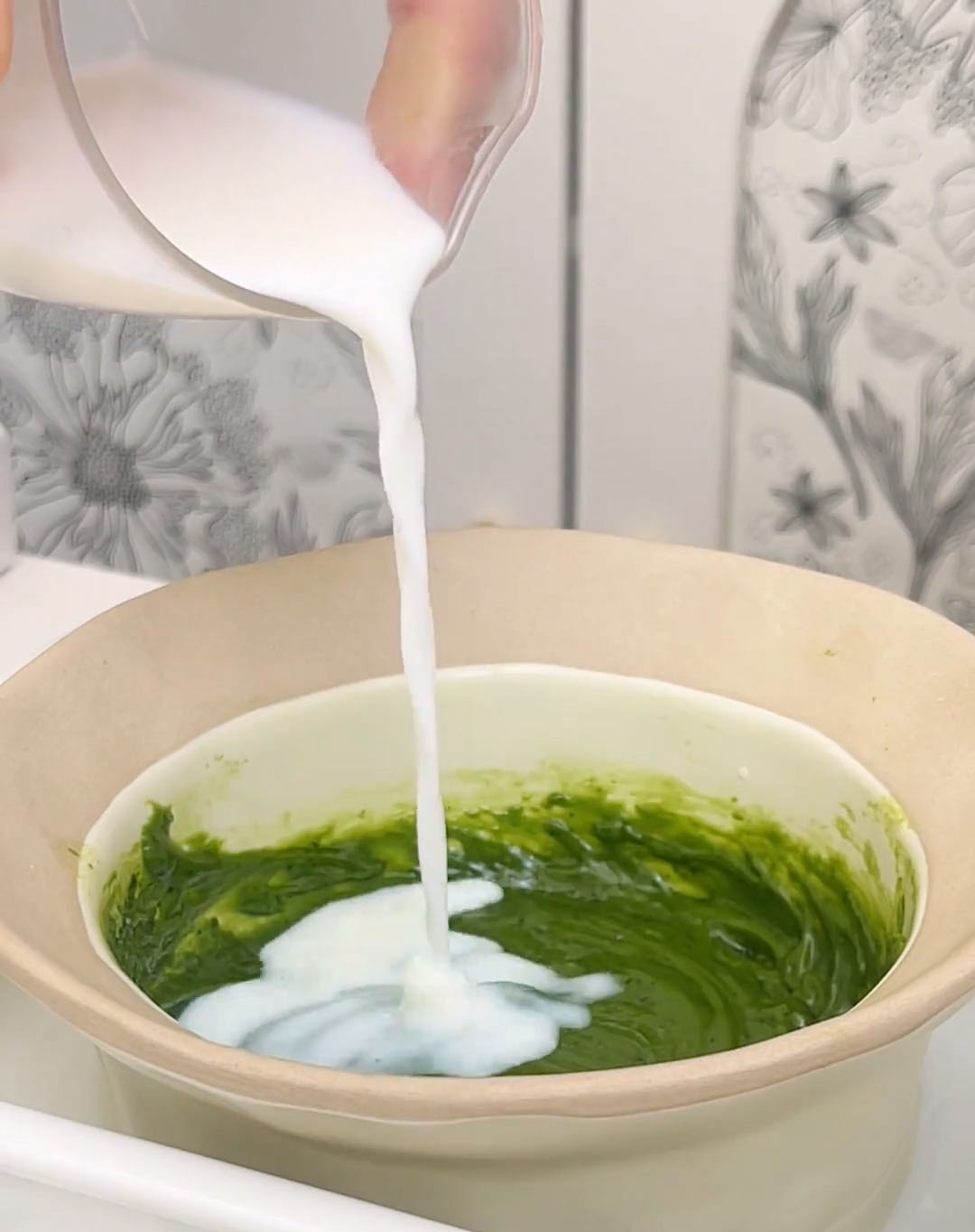 pour 70 g of milk into the matcha chocolate paste