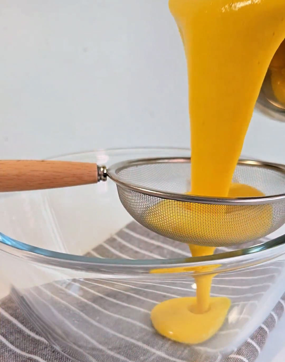 strain the entire mixture through a fine mesh sieve twice