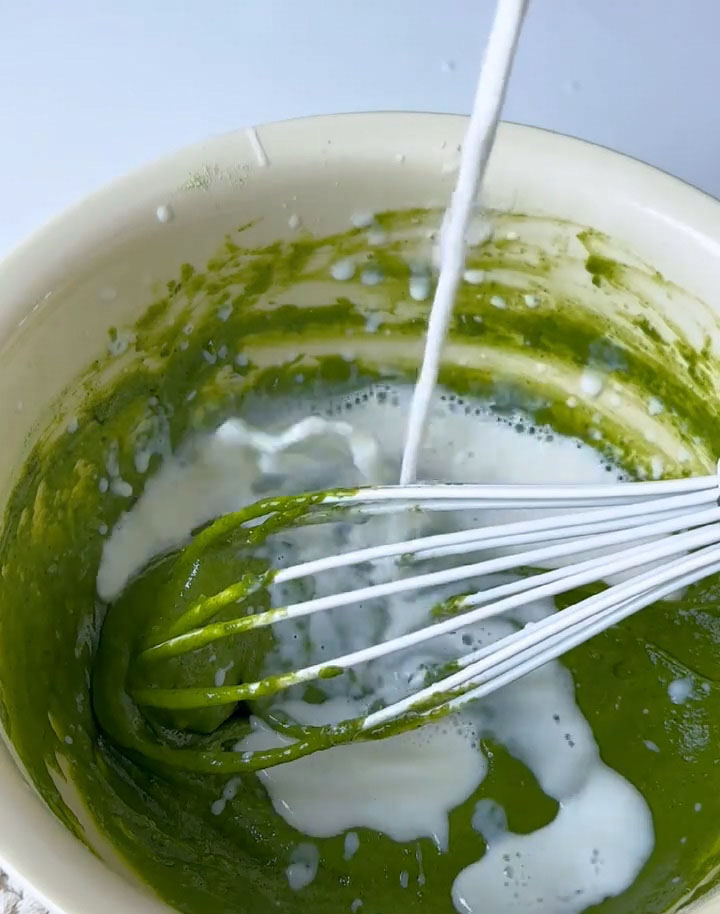 Add the milk in two batches, mixing well after each addition.