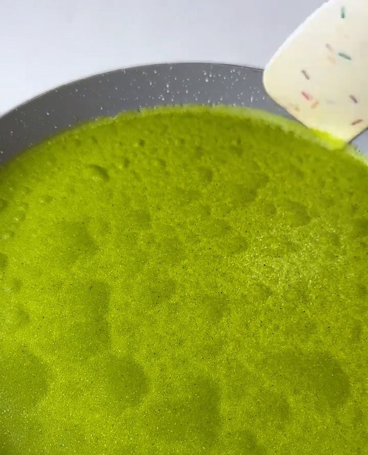 Carefully lift the edge with a spatula