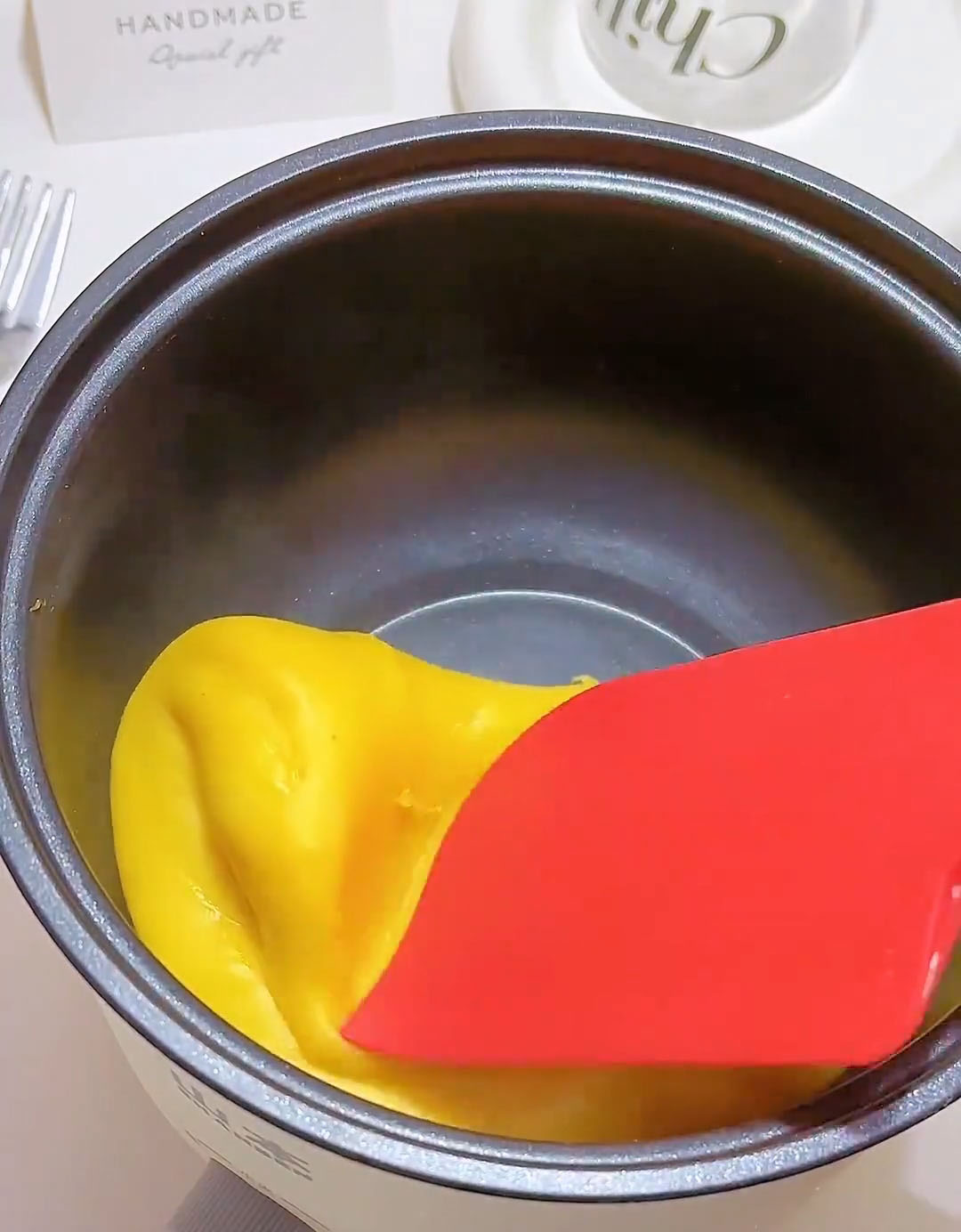 Continue stirring and folding until the dough pulls away from the sides of the pan and forms a single, solid mass