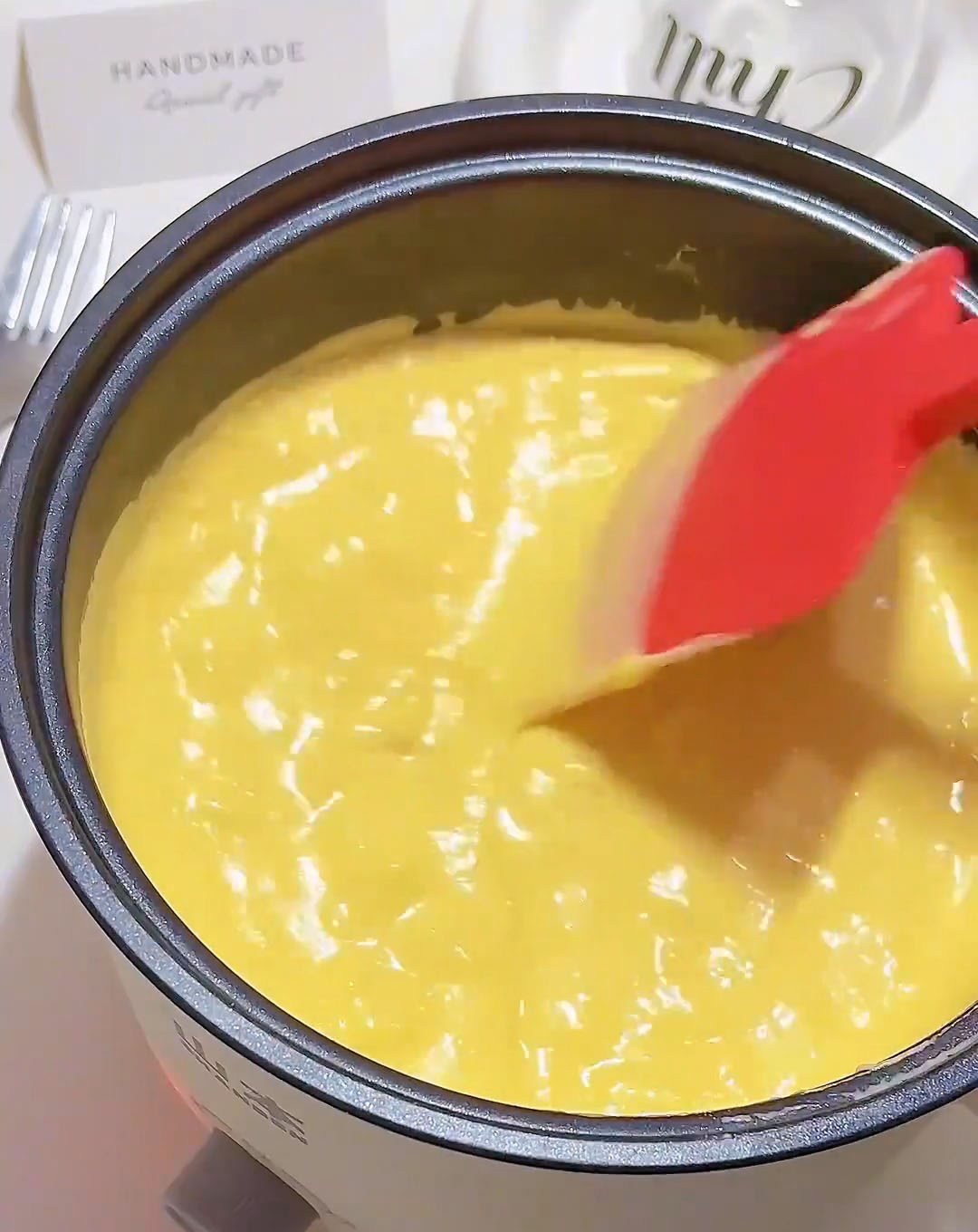 Cook the mixture, stirring constantly with a spatula