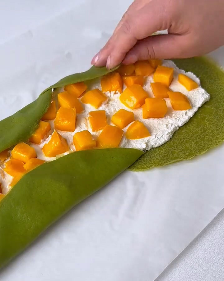 Fold the left and right edges of the crepes inward over the filling