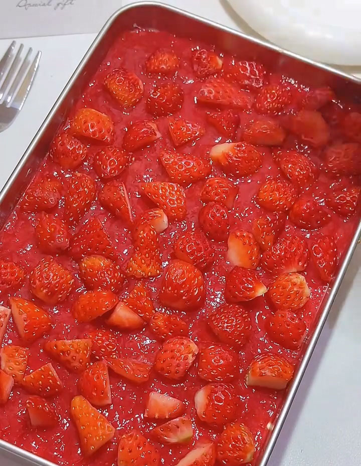 Garnish generously with fresh strawberry cubes