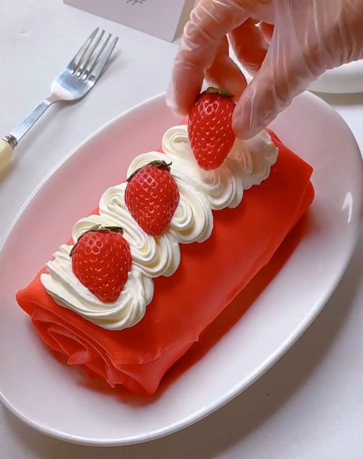 Garnish with halved fresh strawberries.