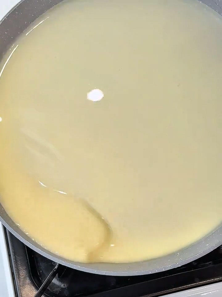 Immediately tilt and swirl the pan in a circular motion so the batter spreads into a very thin, even layer