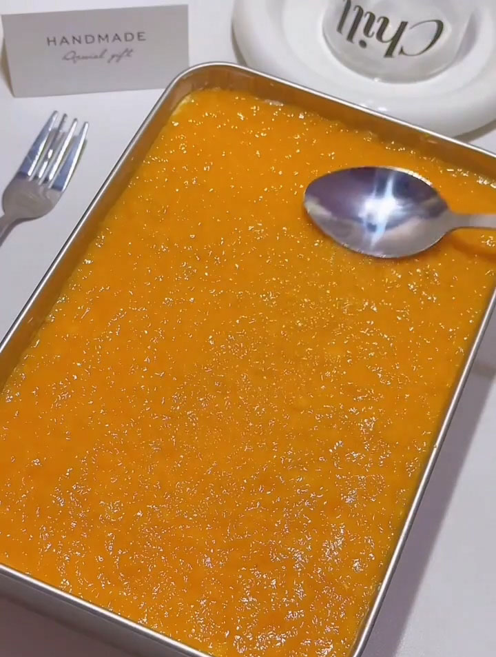 Once fully chilled and set, spread a thin, even layer of mango jam