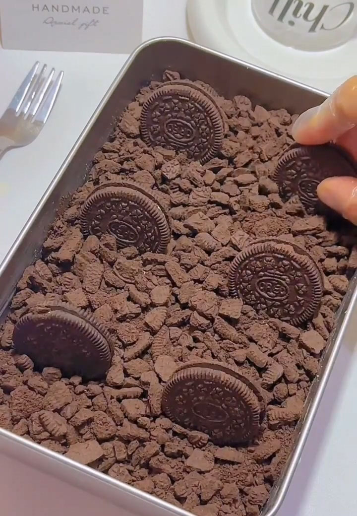 Place 6 whole Oreo cookies (cream filling still intact) on top of the crumbs for a beautiful finishing touch