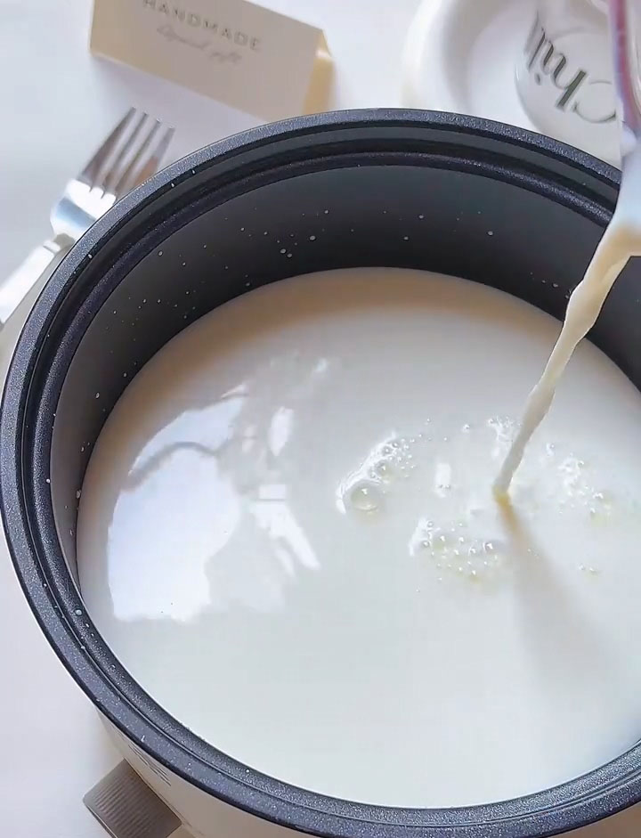 Pour the mixture into a non stick pan. Add the heavy cream.