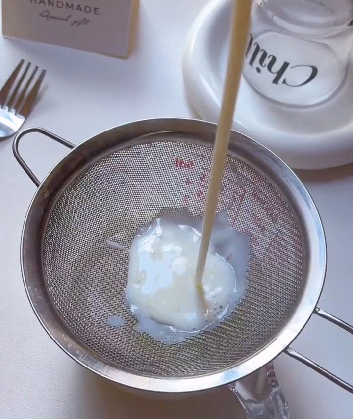 Pour the thickened mixture through a fine mesh strainer into a clean bowl