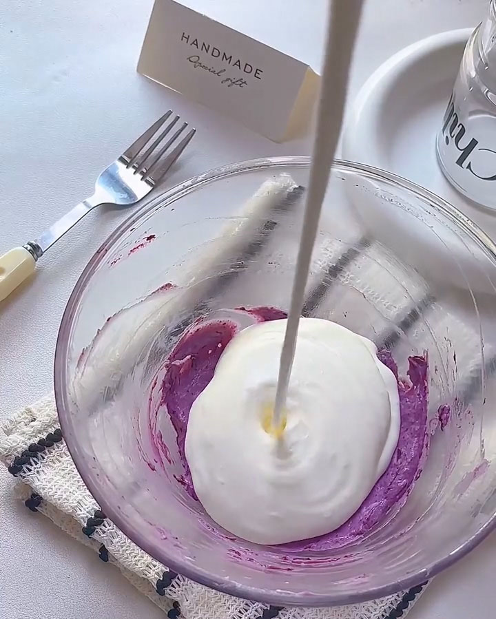 Pour the whipped cream into the bowl with the blueberry cream cheese mixture