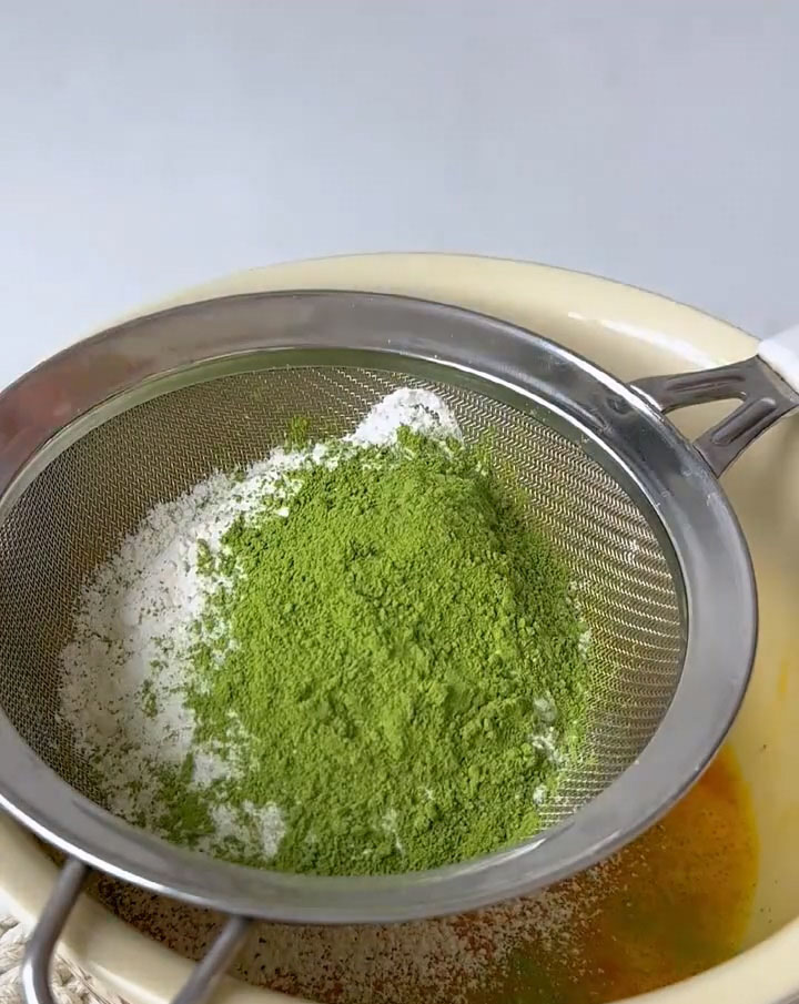 Sift in the cake flour and matcha powder