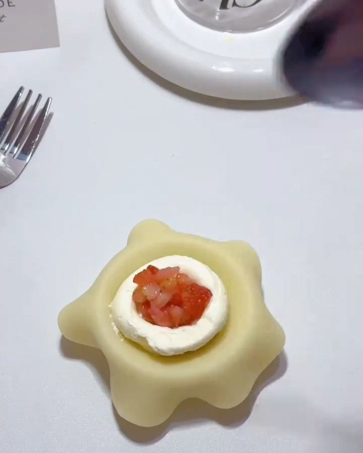 Spoon a scoop of diced strawberries on top of the whipped cream.