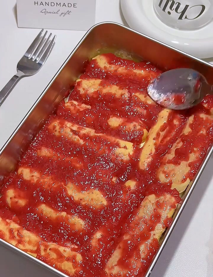 Spread a generous layer of strawberry jam