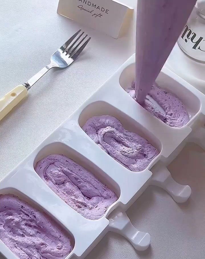 Squeeze or spoon the mixture into your popsicle molds
