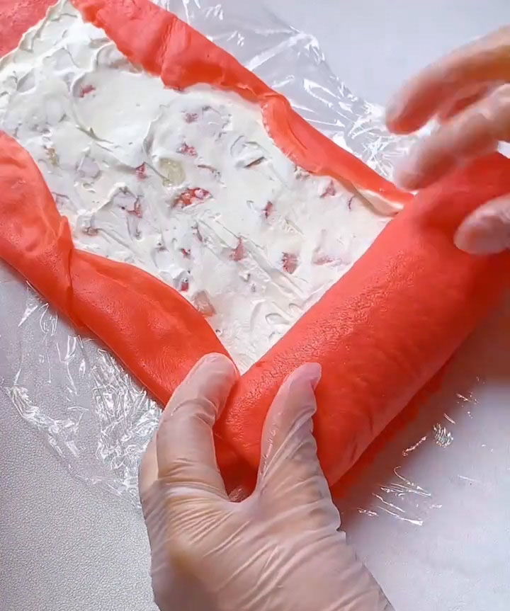 Starting from one short end, carefully roll the crepes into a tight log