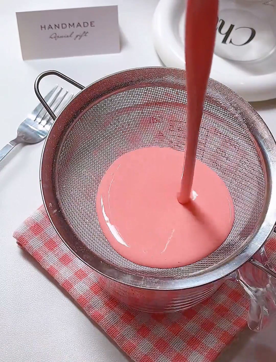 Strain the batter through a fine mesh sieve once