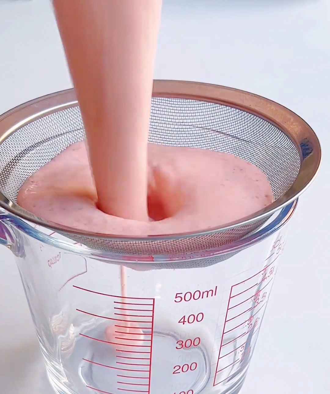 Strain to remove strawberry seeds