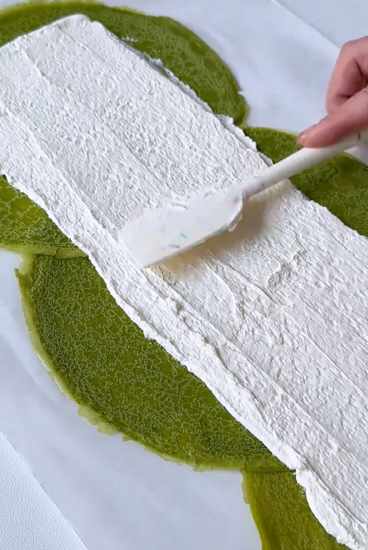 Use an offset spatula or the back of a spoon to smooth the cream into an even layer