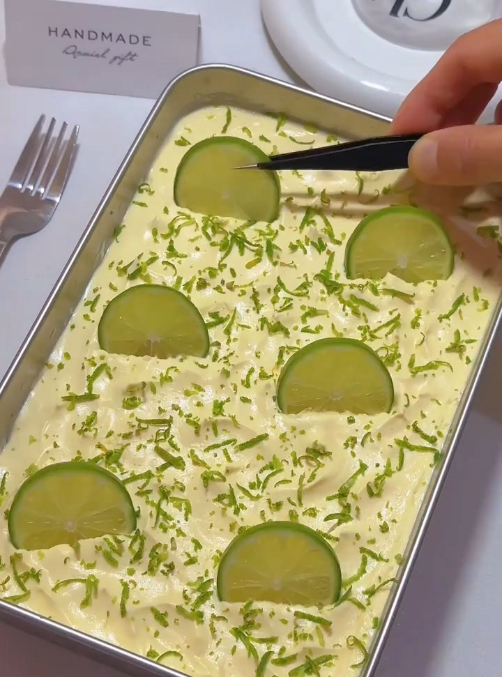 garnish the top with fresh lemon zest and a few small lemon wedges or lemon slices