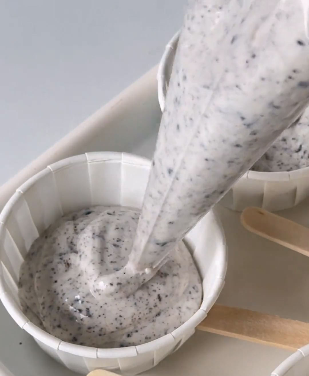 pipe the Oreo ice cream mixture into each paper cup