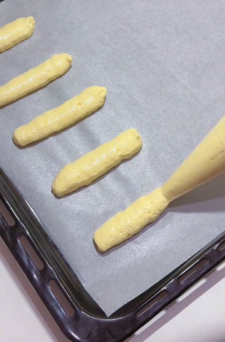 pipe the batter into finger length strips